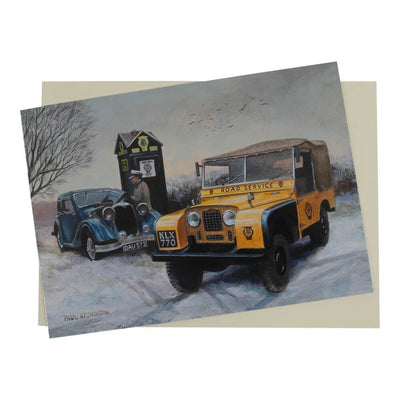 Christmas card features a yellow AA Road Service Series 1 Land Rover coming to the aid of a Riley Falcon in a wintering snow-covered setting.